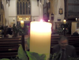 a lit stubbly candle